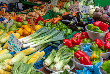 Peppers, corn, leek and other vegetables for sale at a market in Brixton, London