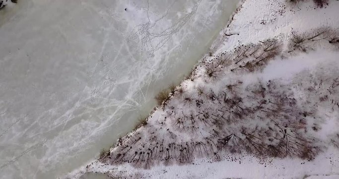 Drone Top Down View of Outskirts of Gomel Belarus and Ice Fisherman on River