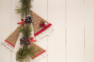 Christmas handmade baubles on white wood table. Christmas background top view. Merry Christmas postcard. Happy new year. Winter holiday frame. Flat lay.