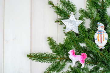 Spruce branch with old vintage Christmas toys