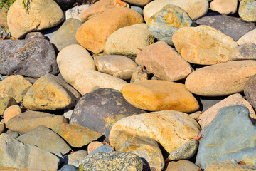 Big natural stones abstract background. Many large cobblestones for rockery in garden landscape design close up. Boulders texture backdrop - base design in grunge style