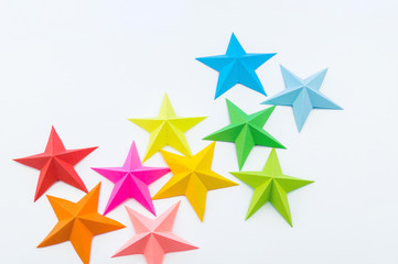 A star made of rainbow-colored paper