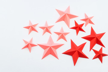Obraz premium Star made of paper color red pink.
