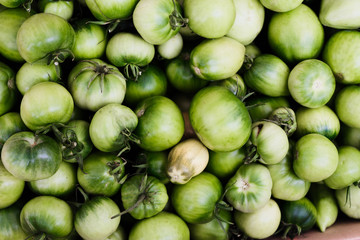 many green tomatoes top view