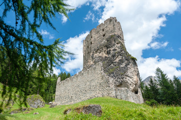 Remains of the olld Ruined Castle Andraz in the Italian Dolomite Mountains. Summer afternoon of 2018.