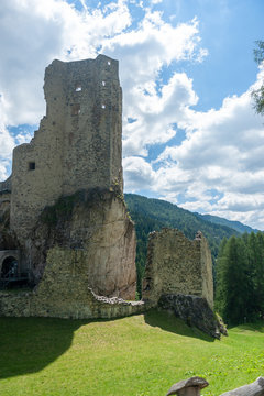 Remains of the olld Ruined Castle Andraz in the Italian Dolomite Mountains. Summer afternoon of 2018.