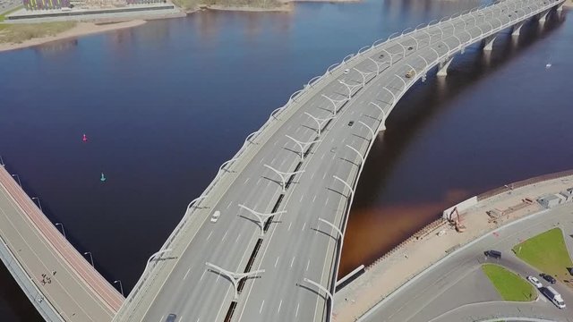 Big highway on a shore with cars passing by aerial view on Saint-Petersburg city panorama