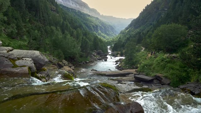 Water flowing at waterfall in Ordesa y Monte Perdido National Park, Spain. 4K, UHD