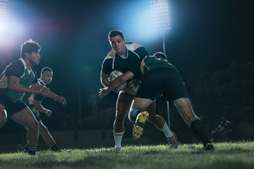 Intense rugby action at sports arena - obrazy, fototapety, plakaty