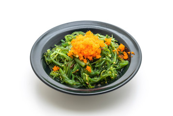 seaweed salad with shrimp eggs isolated on white background