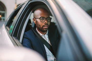 Businessman driving a car to office