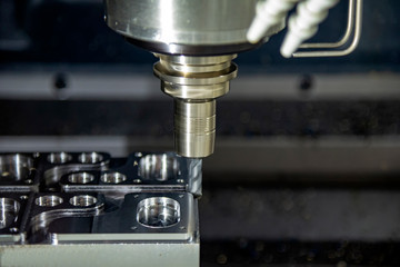 The CNC milling machine cutting the forging mold part by solid radius end mill tool.Mold manufacturing process.