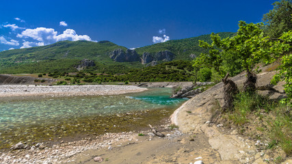 Sandy shore of a small mountain river