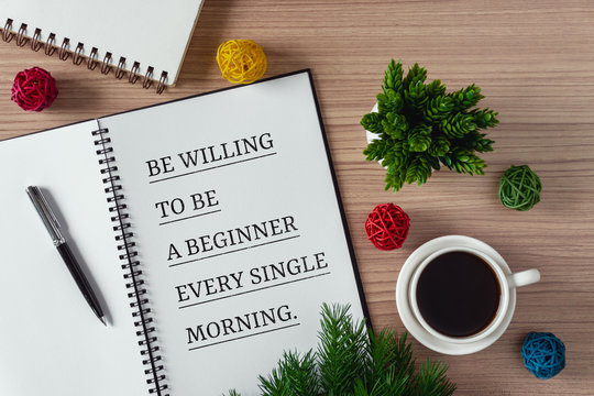 Inspirational and motivation life quote on notepad - Be willing to be a beginner every single morning.