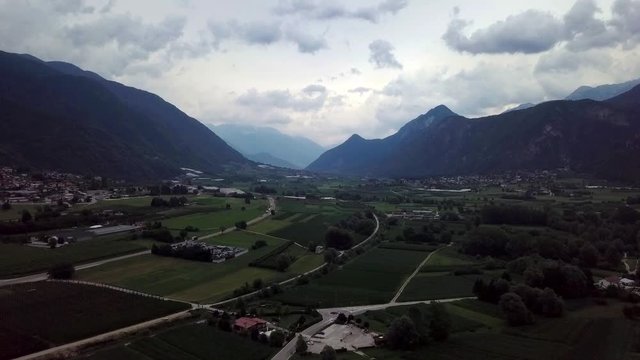 Aerial panoramic view of Levico Terme, Italy, during sunrise with views of the mountains.