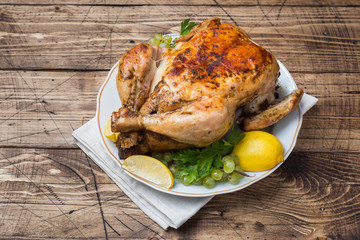 Baked chicken with stuffing for dinner on the holiday table. copy space