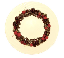 Assortment of Freshly Picked Berries on White Background Shaped as Circle.