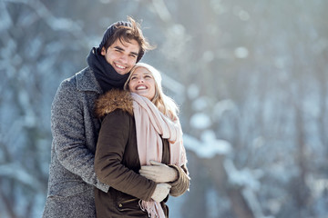 Two young people enjoying in the snow