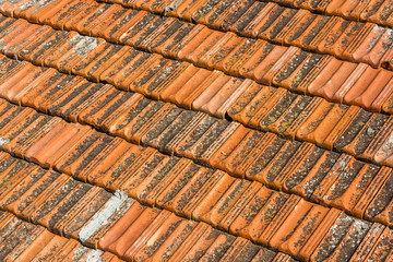 Tiled orange roof of the old house
