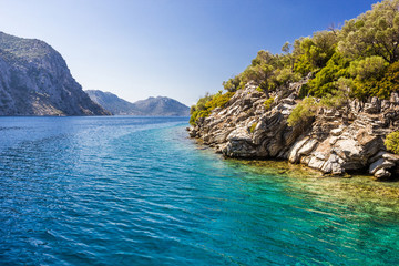Fototapeta na wymiar Rocky coast of the island in the Aegean sea