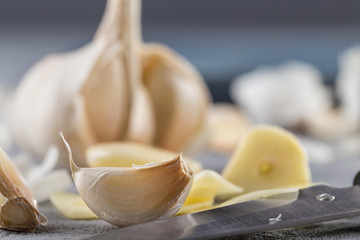 Garlic heads close-up on grey background. Condiment.