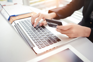 shopping and online payment by using laptop computer and tablet with credit card