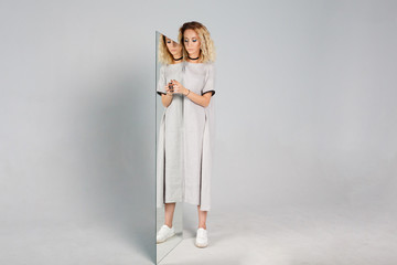 portrait of woman and her reflection