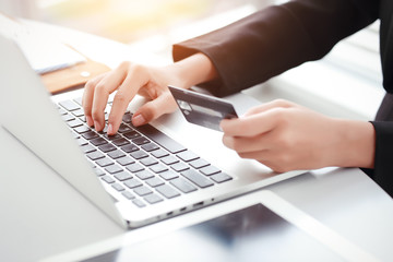 shopping and online payment by using laptop computer and tablet with credit card