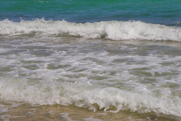 a beautiful beach with blue waters
