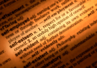 CLOSE UP OF DICTIONARY PAGE SHOWING DEFINITION OF THE WORDS SELF ESTEEM
