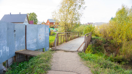 small iron bridge across the river