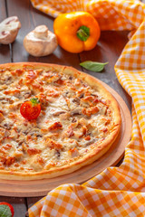 Delicious fresh pizza served on wooden table