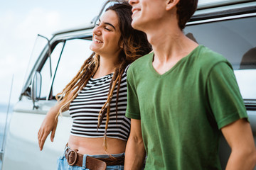 Hipster couple relaxing on her summer road trip