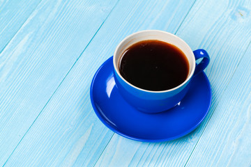 Bright colored coffee cup on a table top view