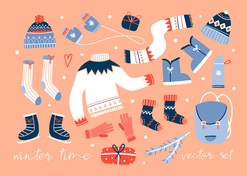 Cozy winter clothes and other stuff. Colored vector set. Peach background. All elements are isolated