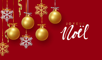 French text Joyeux Noel. Christmas greeting card, design of xmas balls with golden glitter snowflake hanging on the ribbon.