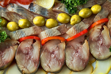 Plate with fish platter on blue background
