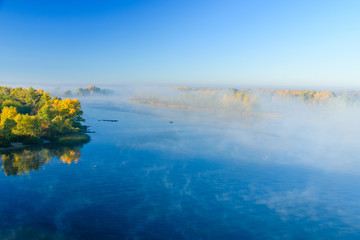 Fog over the water on a river Dnieper on autumn