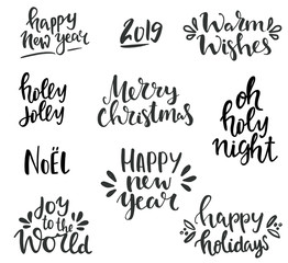 Winter holidays lettering set. Hand written Merry Christmas and happy new year lettering and typography collection. Isolated black on white phrases
