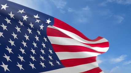 USA fabric flag waving in the blue sky.