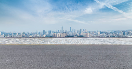 Panoramic skyline and modern business office buildings with empty road,empty concrete square floor