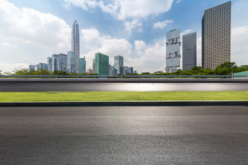 Panoramic skyline and modern business office buildings with empty road,empty concrete square floor