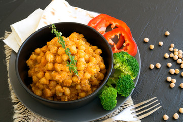 Turkish chickpeas stewed in spicy sauce. Oriental dish.