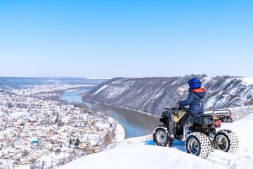 Travel in the winter on the ATV. Beautiful winter nature.