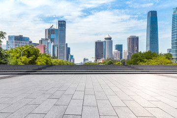 Panoramic skyline and modern business office buildings with empty road,empty concrete square floor