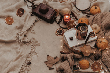 Fototapeta na wymiar Flat lay Autumn composition. Pumpkins, candles, dried leaves on cozy background. Autumn, fall, halloween concept. Flat lay, top view, copy space