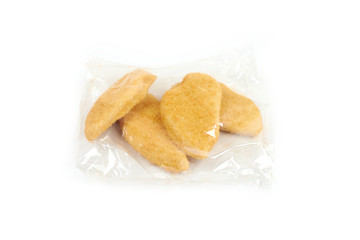 fried chicken breast in a transparent packageon white background.