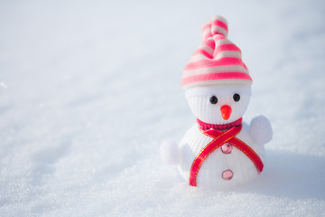 Snowman in the snow. Winter time scene.