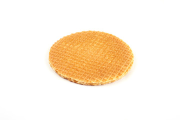 Dutch waffle called a stroopwafel isolated on a white background.