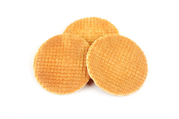 Dutch waffle called a stroopwafel isolated on a white background.